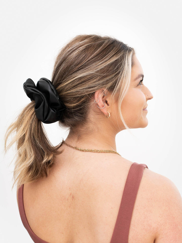 Black Faux Leather Scrunchie size: Next Level in blonde hair ponytail