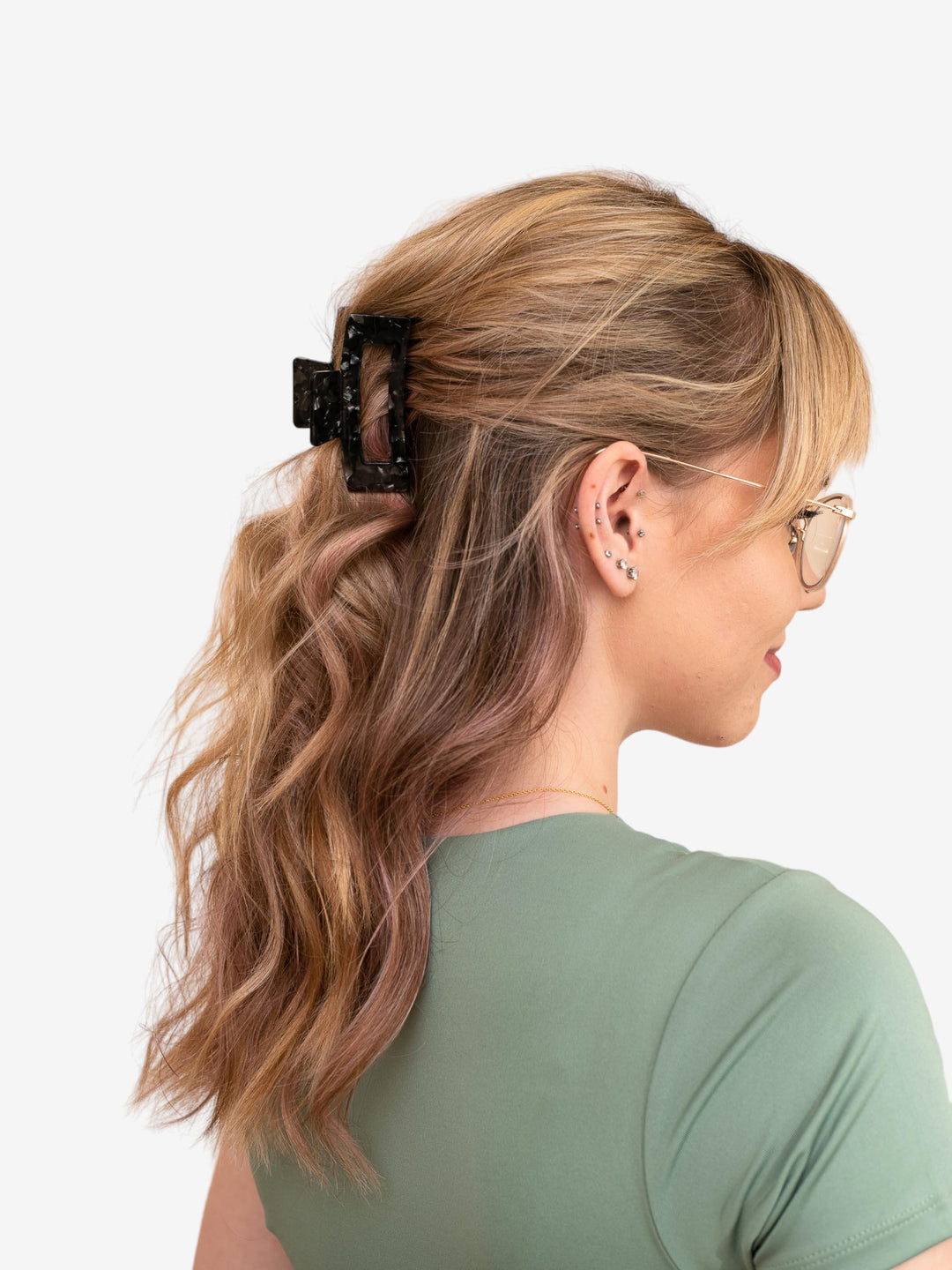 Side profile of model with medium-length hair wearing basic (small) claw clip in black onyx.