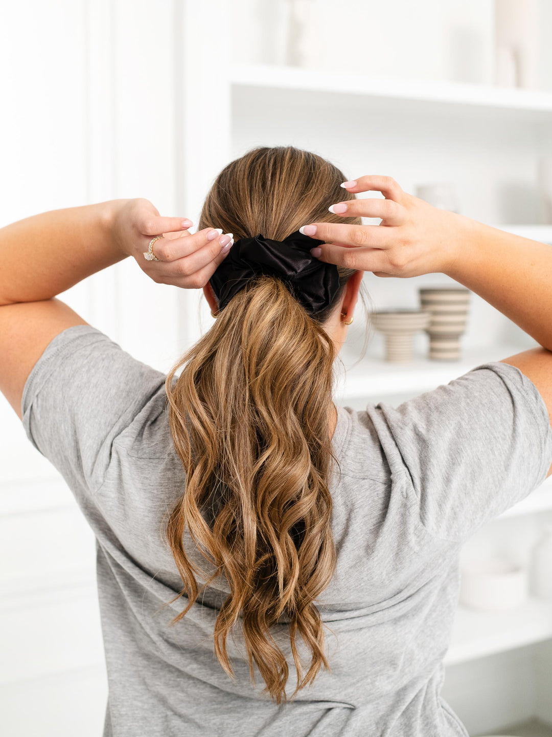 Flirty Pineapple black satin scrunchie in a ponytail – stylish and hair-friendly