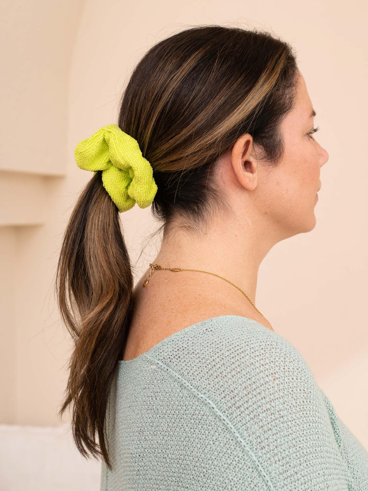 Lime green towel scrunchie in ponytail