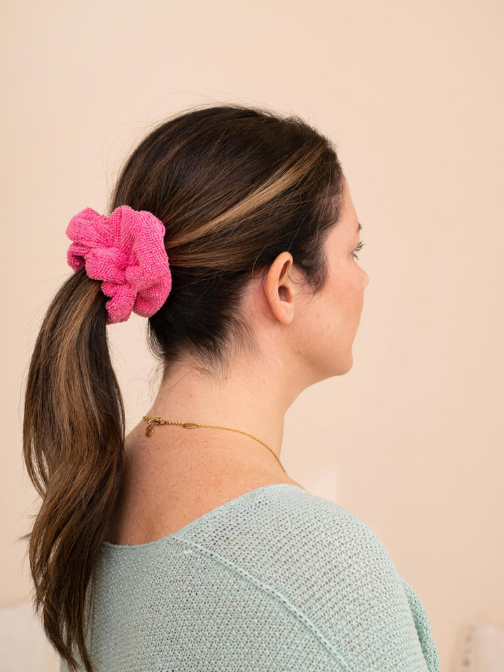 Hair wrapped in a pink towel scrunchie - ultra absorbent for all hair types