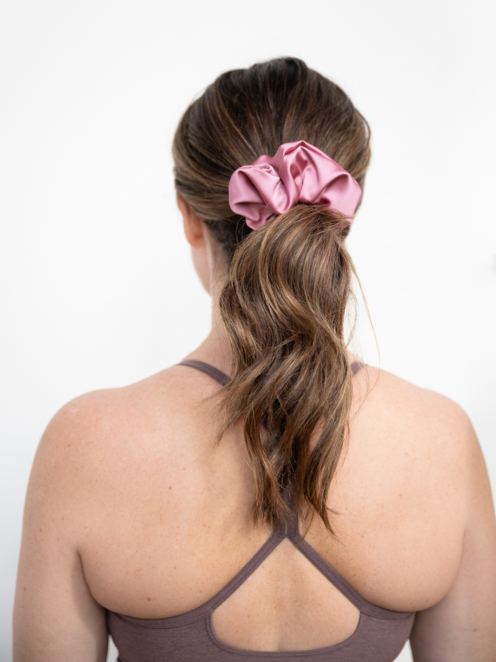 Elegant ponytail featuring a rose pink satin scrunchie – gentle on hair, strong hold