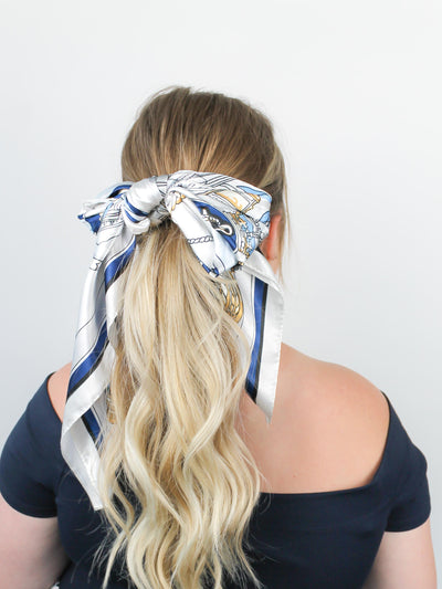 Feeling Nauti-cal Hair Scarf in blonde hair tied in a bow around ponytail