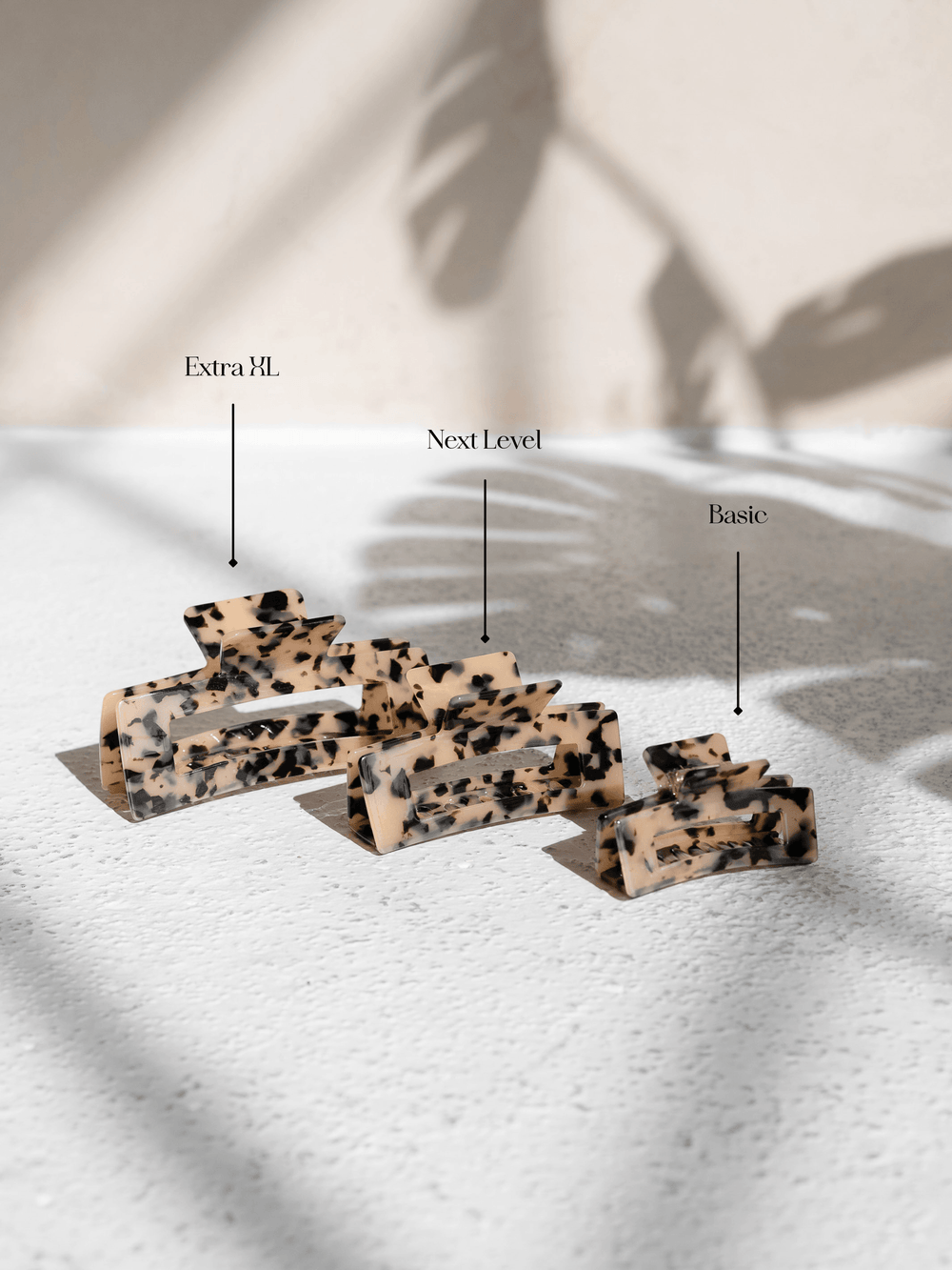 Comparison of Extra XL, Next Level, and Basic claw clips in light tortoise shell – designed for all hair types.